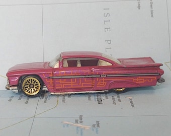 Hot Wheels 1997 Chevy Impala Mattel Pink with Orange Tampo