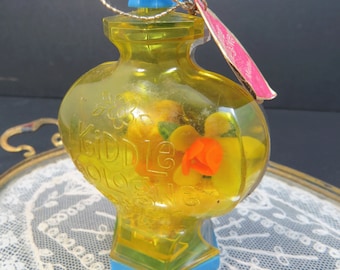 little dolls in perfume bottles