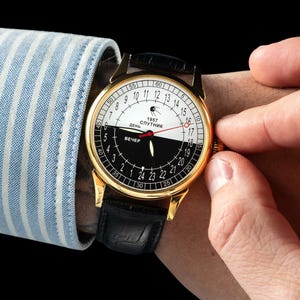 Vintage Sputnik Day-Night Mechanical Watch: 1957 Raketa, Black & White Dial