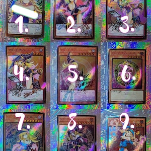 May include: Nine collectible trading cards featuring the character "Black Magician Girl" are displayed. Each card has a holographic foil background and features a different illustration of the character. The cards have Japanese text and are numbered 1 through 9.
