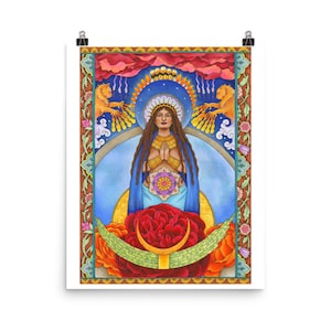 May include: A framed art print featuring a woman with long brown hair, hands clasped in prayer, and a blue cloak. The artwork includes a floral design, a crescent moon, and two golden lions. The color palette includes red, orange, blue, and gold.