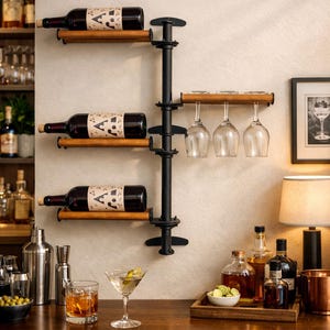 May include: A wall-mounted wine rack featuring a vertical black metal pipe frame with three horizontal wooden shelves for wine bottles and one wooden shelf with slots for hanging three stemmed wine glasses, all arranged in a modular design.