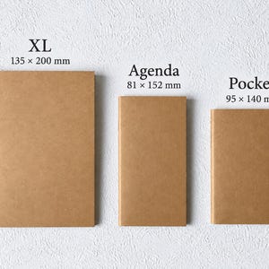 May include: Three rectangular brown notebooks labeled XL, Agenda, and Pocket. The XL notebook measures 135 x 200 mm, the Agenda notebook measures 81 x 152 mm, and the Pocket notebook measures 95 x 140 mm. Each notebook has a plain, solid brown cover.