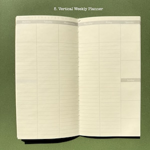May include: An open vertical weekly planner with cream-colored pages featuring a grid layout for Monday through Sunday. The top header displays the text 5. Vertical Weekly Planner and includes a monthly calendar tracker numbered 1 through 12.