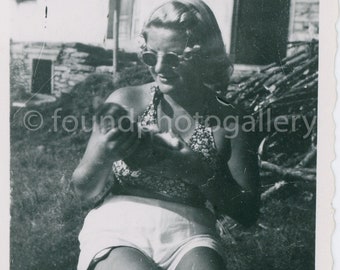 Beautiful Blonde In Sunglasses, a Halter Top and Shorts Getting Some Rays, Vintage Photo