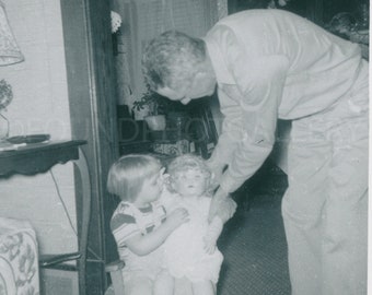 Father Playing with Daughter Holding a Large Doll in Her Lap, Vintage Photo,  Snapshot, Vernacular Photo