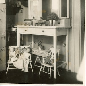 Children’s Room with Painted Vanity with Lovely Plant In Striped Vase, Dolls in Dolly Chairs, 1940’s Vintage Photo