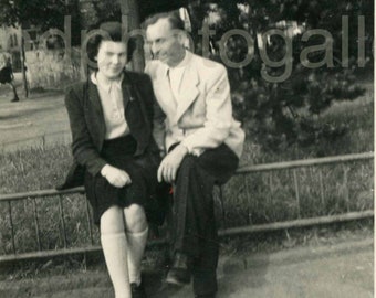 Loving Couple Sitting on Railing in Park in Germany, Black & White Photo, Found Photo, Old Photo, Snapshot √