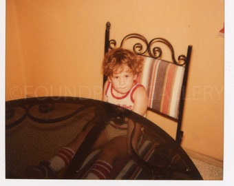 Little Boy Wearing Underwear and Socks Sitting at Round Smoked Glass Table, Pumpkin Colored Wall, Vintage Photo, Color Snapshot, Polaroid