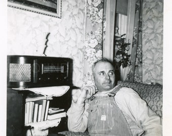 Burly Railroad Worker in Overalls Sitting in His Favorite Armchair By His Vintage Radio in a Cosy 1930’s Living Room, Vintage Photo