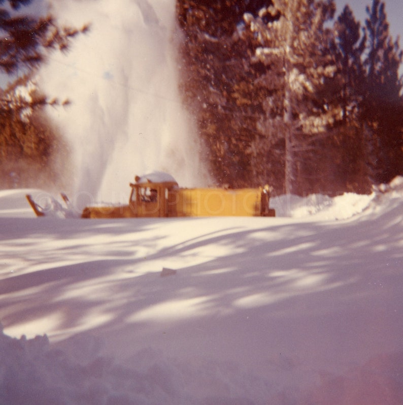 Bright Yellow Snow Blower Cleaning After Huge Snowstorm, Color Snapshot