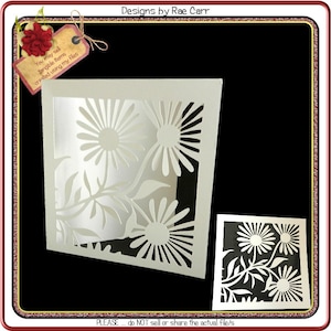 May include: A white card with a cut-out design of daisies and leaves. The card is on a black background. The text "You may sell tangible items created using my files" is on a small tag in the upper left corner. The text "Designs by Rae Carr" is in the upper right corner. The text "PLEASE... do NOT sell or share the actual file/s" is at the bottom of the image.