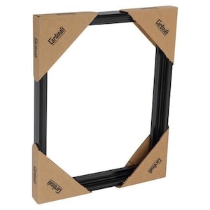 May include: A black picture frame with cardboard corner protectors. The frame is rectangular with a beveled edge. The cardboard protectors are tan and have the word "Cardinali" printed on them.
