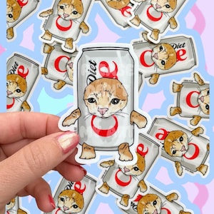 May include: A set of stickers featuring a cartoon cat wearing a Diet Coke can as a costume. The cat is orange and white with a surprised expression. The stickers are printed on white paper with a glossy finish.