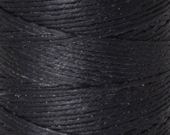 May include: Close-up of a spool of black waxed thread. The thread is tightly wound and has a smooth, polished finish.