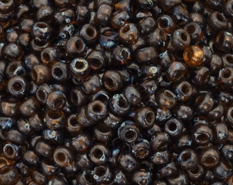 Seed Beads-6/0 Round-4502 Transparent Dark Topaz Picasso-Miyuki-16 Grams