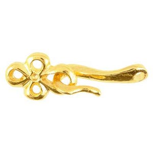 May include: Gold-toned metal clasp with a flower-shaped design. The clasp is designed to be used for necklaces, bracelets, or other jewelry.