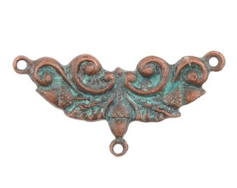 May include: A copper-toned metal connector with an ornate design featuring acorns and leaves. The connector has three loops for attaching jewelry or other crafts.
