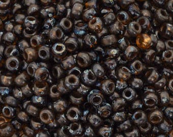 Seed Beads-11/0 Round-4502 Transparent Dark Topaz Picasso-Miyuki-16 Grams
