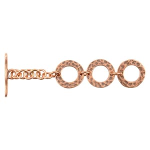 May include: A copper chain with three hammered, circular links. The chain has a toggle clasp.