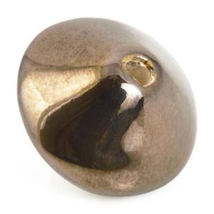 May include: A metallic gold ceramic bead with a smooth, shiny finish. The bead has a small hole in the center for stringing.