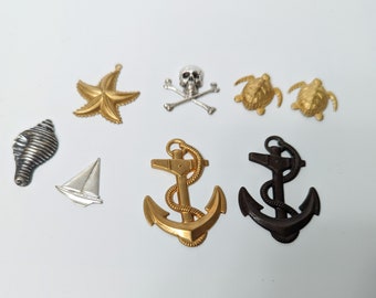 Assorted nautical metal brass stampings, raw brass, nickel, starfish, skull, anchor, turtles