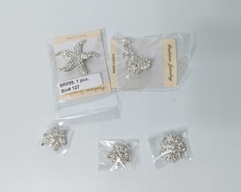 Assorted rhinestone pins and buttons