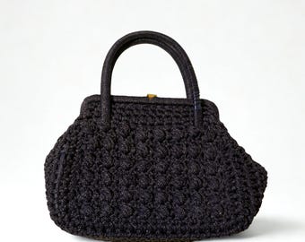 May include: A black handbag with a textured, woven design. The bag has a rounded shape, a handle, and a clasp closure. The style is vintage-inspired, with a classic and elegant aesthetic, suitable for various occasions.