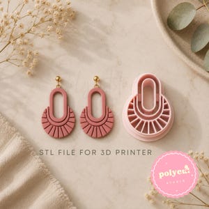 May include: Two dusty rose dangle earrings with a central oval cutout and a fan-shaped base, accompanied by a matching light pink plastic 3D printer cutter mold. The text STL FILE FOR 3D PRINTER is printed in black below the items.