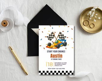 May include: A birthday invitation with a race car theme. The invitation features a colorful race car illustration, checkered flags, and the text "Start Your Engines." The invitation includes the name "Austin" and the age "is turning three."