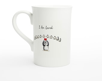 Taza con mensaje de afirmación de Eric el Pingüino: Soy amado/a – 295 ml. Regalo de porcelana para el amor propio, la salud mental y la atención plena.