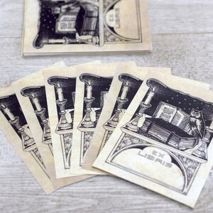 May include: A set of six vintage bookplates featuring an owl perched on a book with candles and the text "Ex Libris".