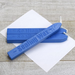 Blauwe zegellakstick met lont
