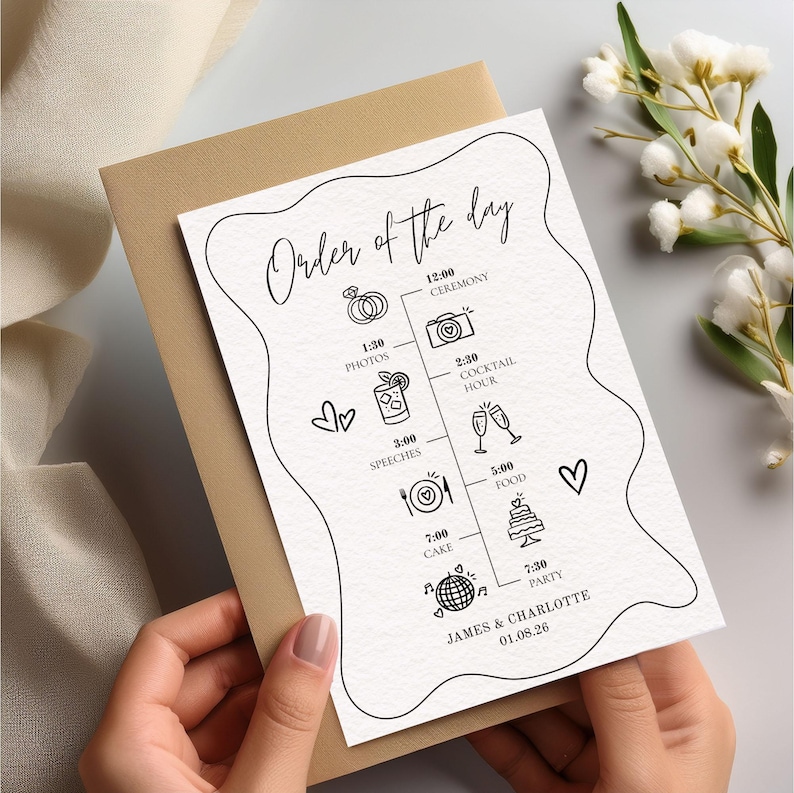 May include: A wedding order of the day card with a beige envelope. The card features a black line drawing of a timeline with icons for ceremony, photos, cocktail hour, speeches, food, cake, and party. The names James & Charlotte and the date 01.08.26 are at the bottom.