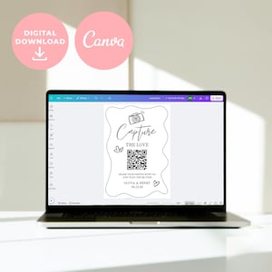May include: A laptop displays a digital wedding invitation design. The invitation features the text "Capture The Love" with a QR code and the names "Olivia & Henry" with the date 04.12.26. Pink circles with the words "Digital Download" and "Canva" are in the top left.