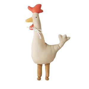 May include: A stuffed rooster toy in cream, orange, yellow, and brown. The rooster has a red comb, yellow beak, and brown legs. A white string is tied around its neck. The toy is designed to stand upright.