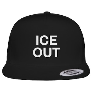 May include: Black trucker hat with the white text "ICE OUT" across the front. The hat has a curved brim and a mesh back. The hat has a snapback closure.