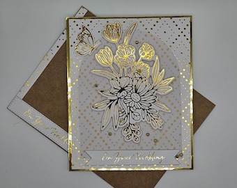 Elegant Wedding card handmade. Shiny gold and white with matching envelope. Gold bouquet and butterfly. Can recreate to personalize.