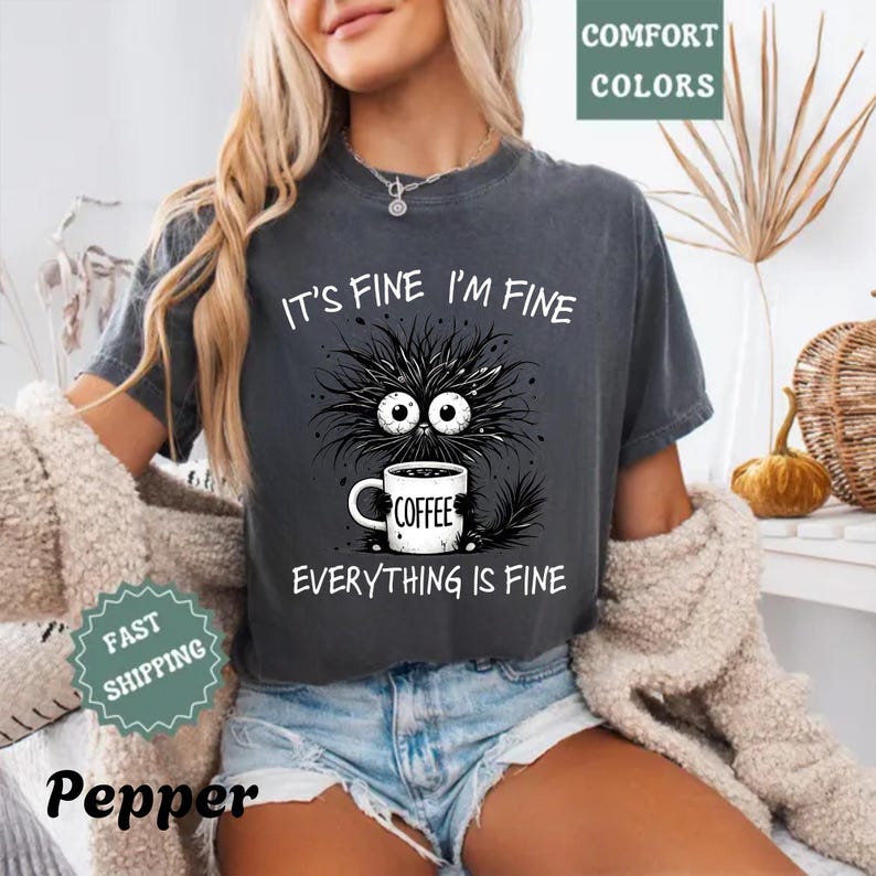 a woman wearing a t - shirt that says it's fine i'm