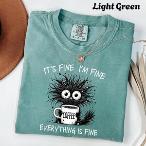 a t - shirt that says it's fine i'm fine everything is