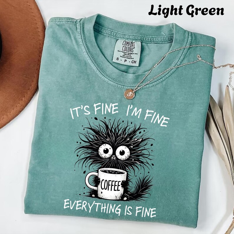 a t - shirt that says it's fine i'm fine everything is