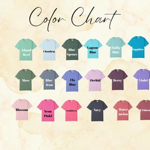 May include: A color chart featuring various t-shirt colors, including Island Reef, Chambray, Blue Spruce, Lagoon Blue, Chalky Mint, and Sapphire. Other colors are Moss, Blue Jean, Flo Blue, Orchid, Berry, and Violet. Additional colors are Blossom, Neon Pinkl, Crubberry, Navy, Watermelon, and Crimson.
