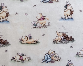 May include: Cream-colored fabric featuring a repeating pattern of Winnie the Pooh and friends. The illustrations depict Pooh Bear, Piglet, Eeyore, and Tigger in various poses, including hugging, carrying honey pots, and playing in a field.