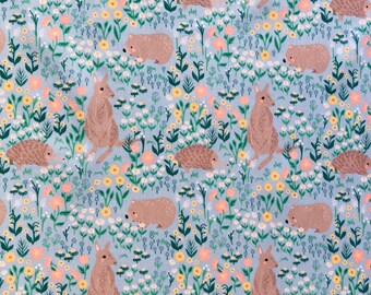 May include: A light blue fabric featuring a repeating pattern of kangaroos, hedgehogs, and other small animals amidst a field of flowers. The flowers are in shades of yellow, peach, and white, with green foliage.