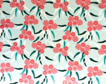 May include: A seamless pattern featuring pink flowers with white and teal leaves on a light blue background.