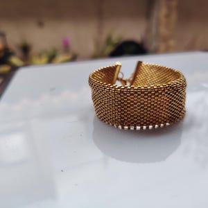 miyuki gold bead cuff, handmade woven bracelet gift, luxury gold mesh wristband, artisanal seed bead cuff, elegant adjustable bracelet, metallic gold beaded band, statement handmade jewelry