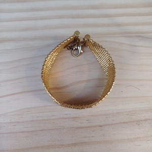 miyuki gold bead cuff, handmade woven bracelet gift, luxury gold mesh wristband, artisanal seed bead cuff, elegant adjustable bracelet, metallic gold beaded band, statement handmade jewelry