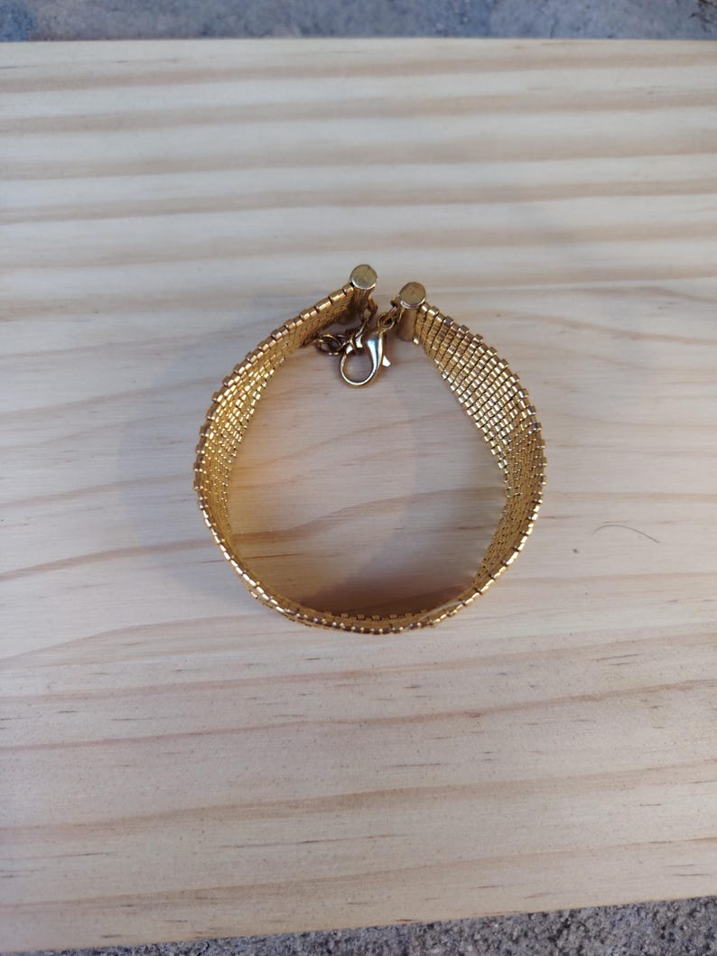 miyuki gold bead cuff, handmade woven bracelet gift, luxury gold mesh wristband, artisanal seed bead cuff, elegant adjustable bracelet, metallic gold beaded band, statement handmade jewelry