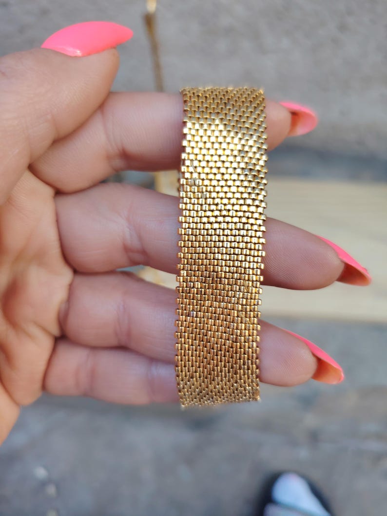 artisan seed bead cuff bracelet with textured gold beads