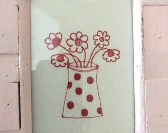 Chippy paint frame with embroidered redwork flowers in dotty pot